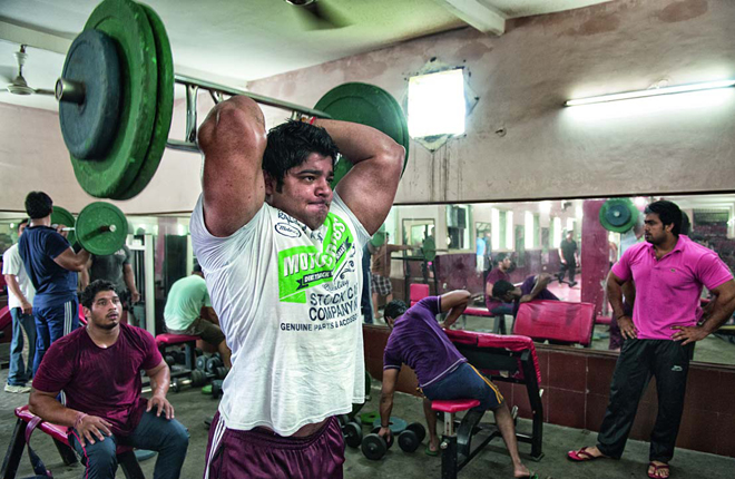 Neeraj Tanwar pumps his 19.5-inch biceps at the village gym