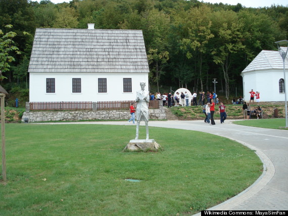 House where Tesla was born (left) and the church where Tesla's father served in Smilijan. Both structures were burned during Yugoslav wars and rebuilt by the Croatian government.