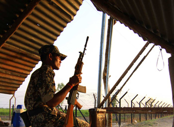  A soldier at his post on the border with Pakistan in the Khemkaran sector