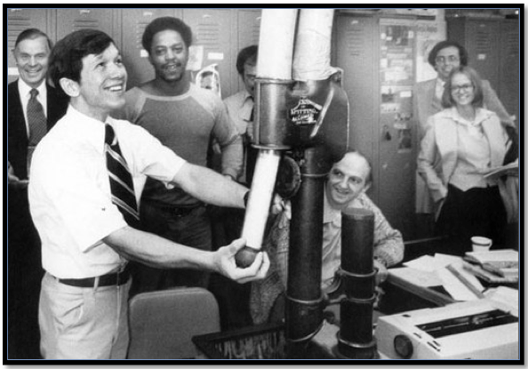 The interdepartmental mail envelope was placed in a pneumatic tube container for transport from office to office.
