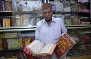 Mumbai: Renowned Sanskrit scholar Pandit Gulam Dastagir at his home in Worli, Mumbai on Dec. 27, 2014. (Photo: Sandeep Mahankal/IANS)