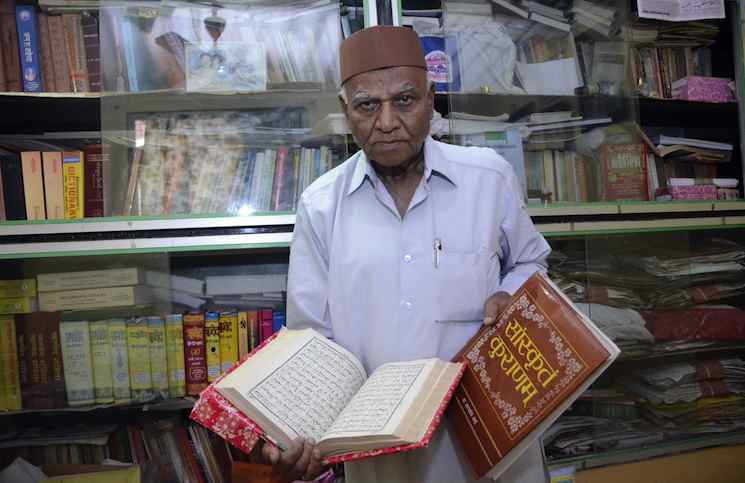 Mumbai: Renowned Sanskrit scholar Pandit Gulam Dastagir at his home in Worli, Mumbai on Dec. 27, 2014. (Photo: Sandeep Mahankal/IANS)