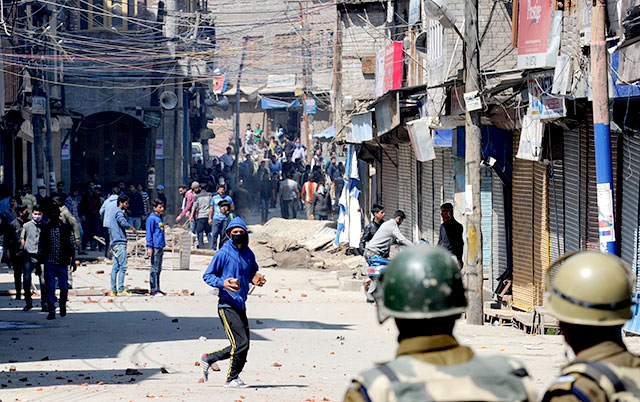 Demonstrators clash with police during a protest in Srinagar against a government proposal to create exclusive settlements for Kashmiri Pandits. AFP Photo