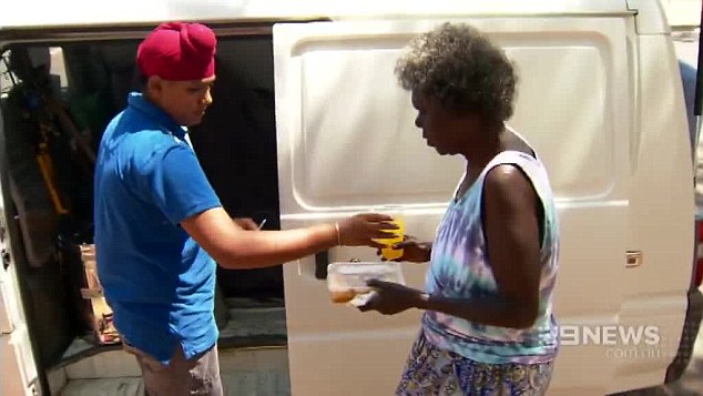 'I help my dad pour cordial for people who are thirsty, they deserve a cold drink ... it's a really hot day', Tejinders son, Navdeep, says