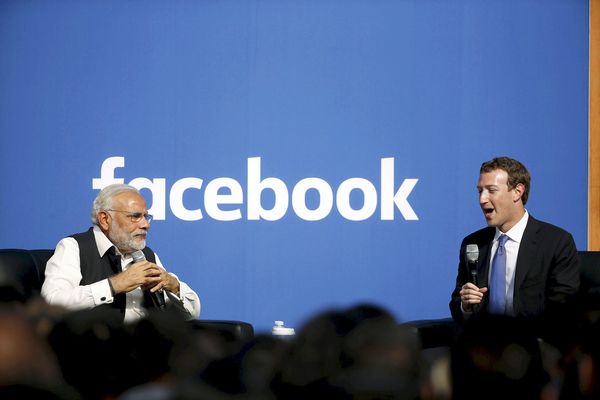 Indian Prime Minister Narendra Modi and Facebook CEO Mark Zuckerberg speak on stage during a town hall at Facebook's headquarters in Menlo Park, California September 27, 2015. REUTERS/Stephen Lam