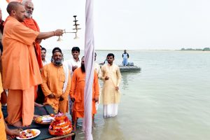 Ayodhya: Uttar Pradesh Chief Minister Yogi Adityanath offer prayers at the Saryu river in Ayodhya, Uttar Pradesh on May 31, 2017. (Photo: IANS)