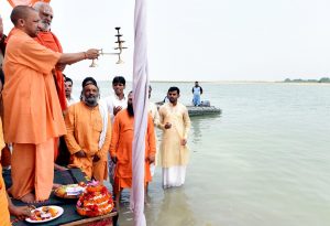 Ayodhya: Uttar Pradesh Chief Minister Yogi Adityanath offer prayers at the Saryu river in Ayodhya, Uttar Pradesh on May 31, 2017. (Photo: IANS)